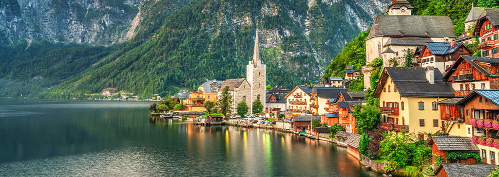 Hallstatt, Austria: A picturesque lakeside village with 16th-century homes set against the Dachstein Alps.