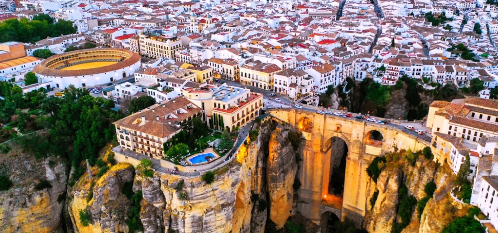 Ronda, Spain: The dramatic Puente Nuevo bridge spanning the El Tajo gorge with scenic cliffs and historic architecture.
