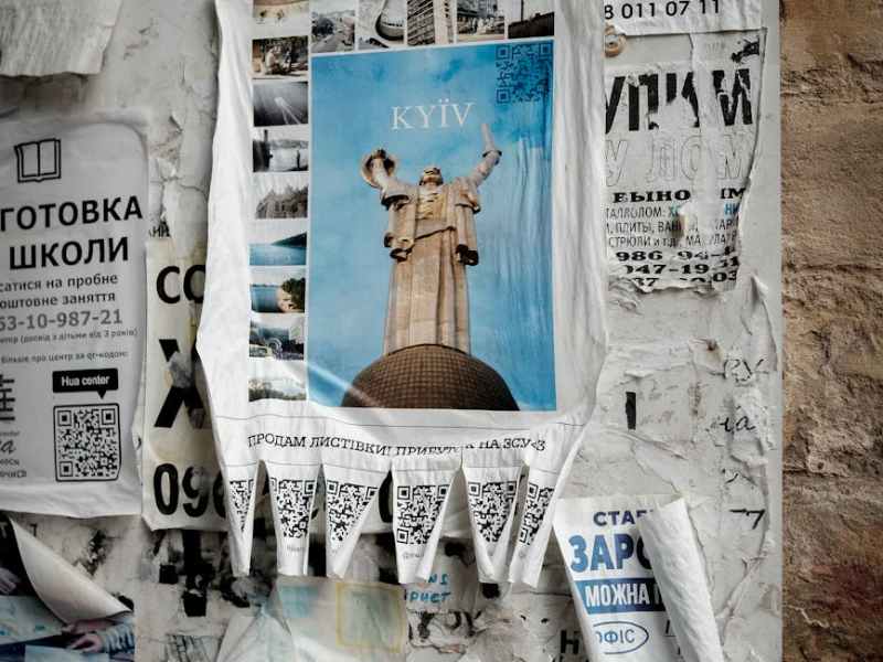 torn newspapers on wall