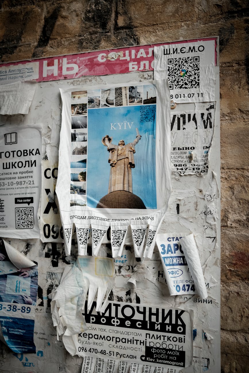 torn newspapers on wall