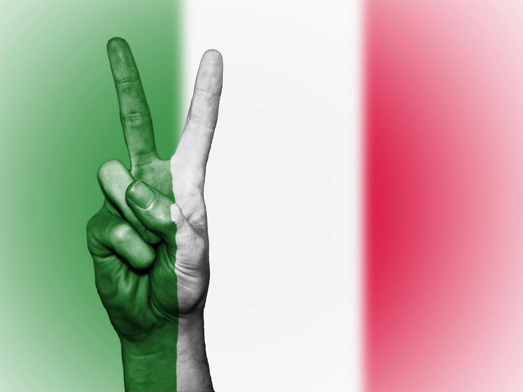April 25th in Italy: Remembering Liberation and the Power of Resistance 8 person s hand doing peace sign with india flag backdrop
