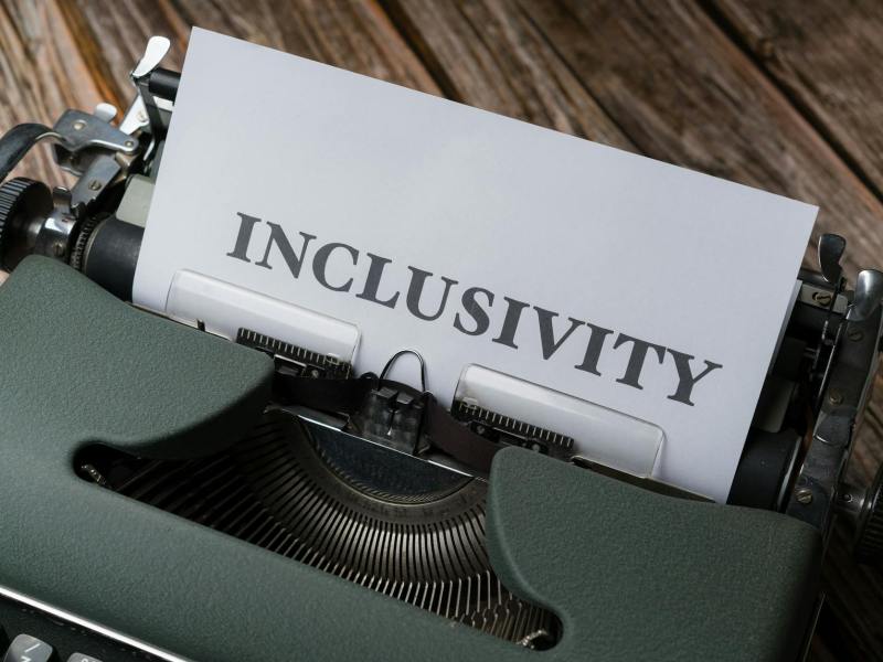 a typewriter with the word inclusivity on it