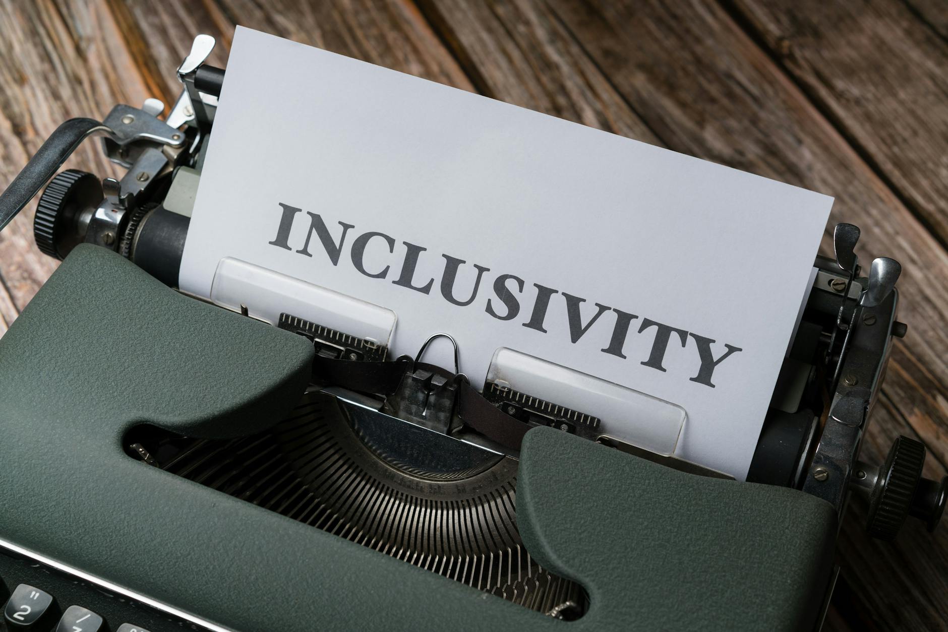 a typewriter with the word inclusivity on it