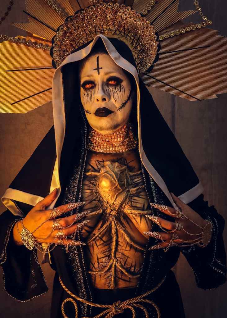 gothic nun with intricate horror makeup and costume fanatismo
