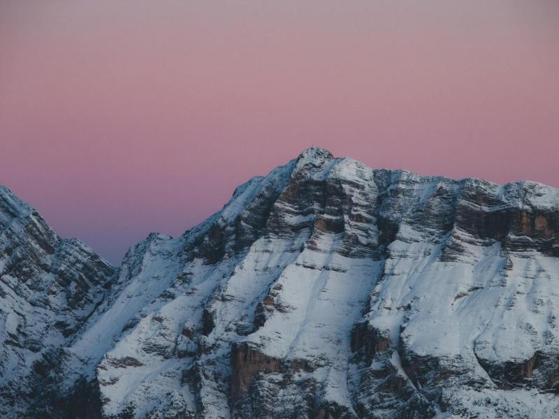 snow covered peaks at sunset in inverno trentino