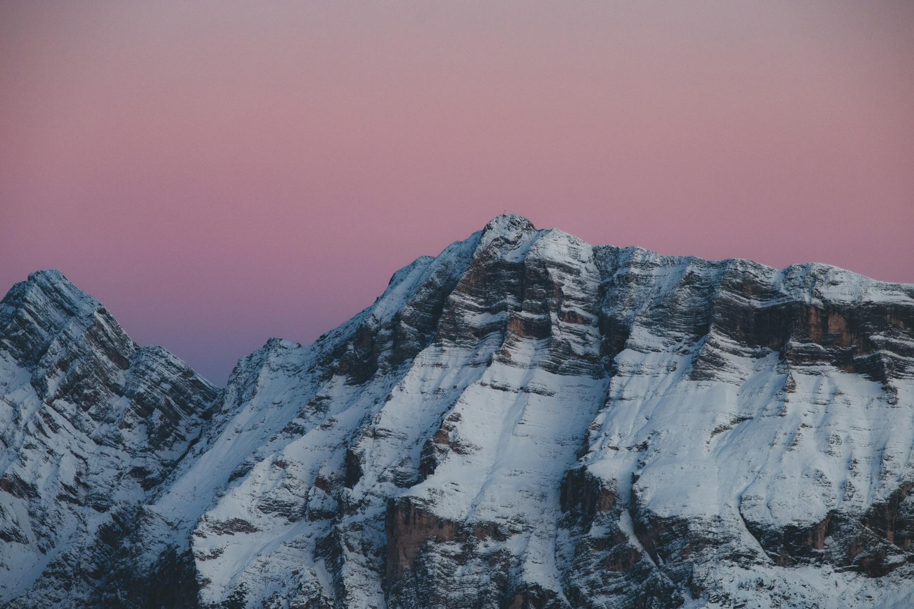 snow covered peaks at sunset in inverno trentino