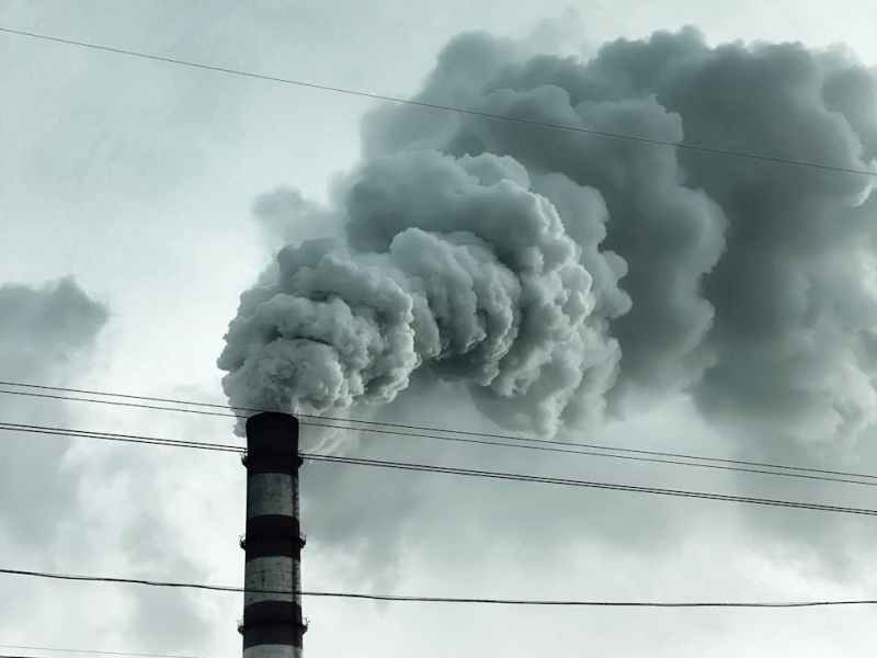 exhaust coming out from an industrial smoke stack
