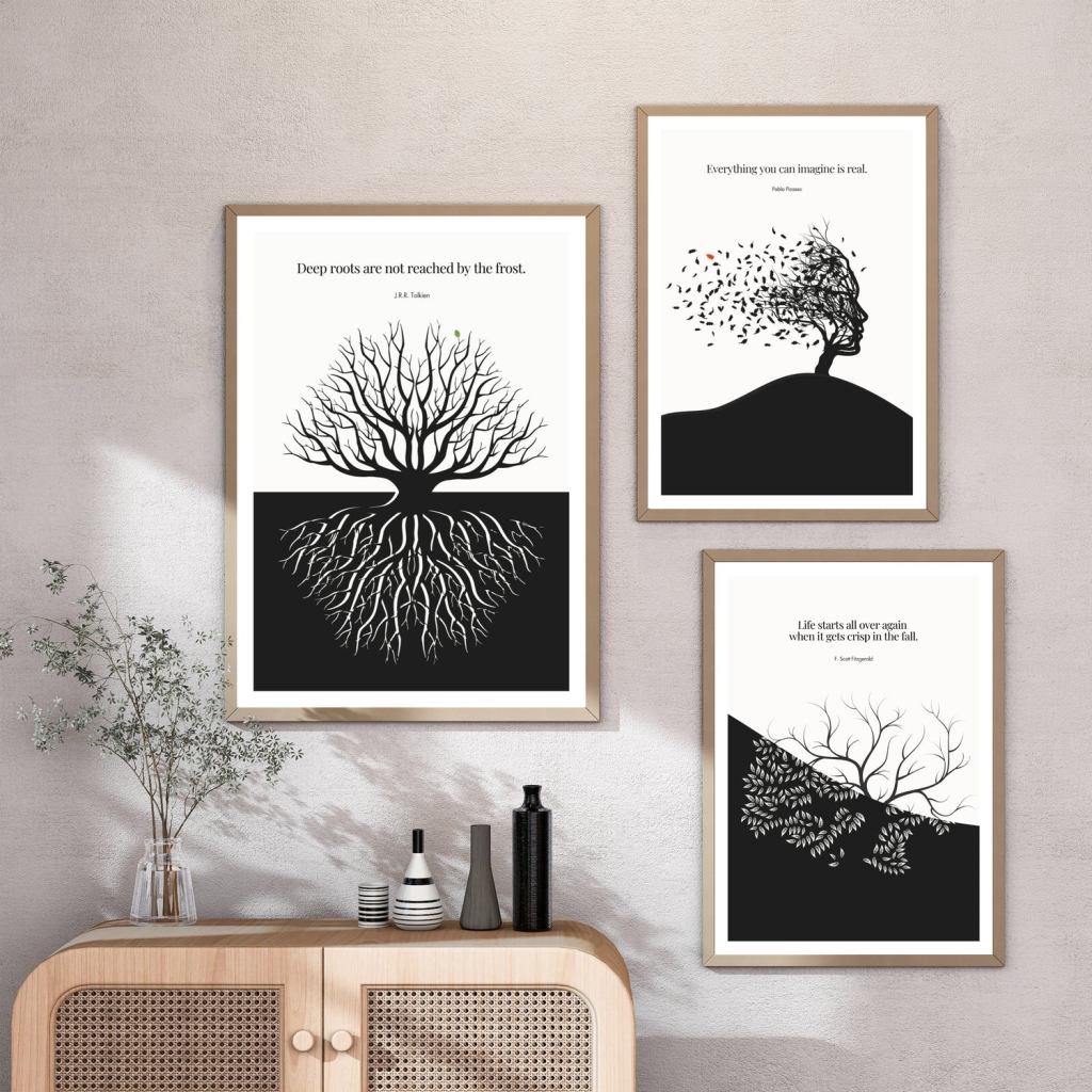 Minimalist quote posters
Three framed black and white wall art prints featuring tree designs and inspirational quotes, arranged above a wooden sideboard with decorative vases and plants.
