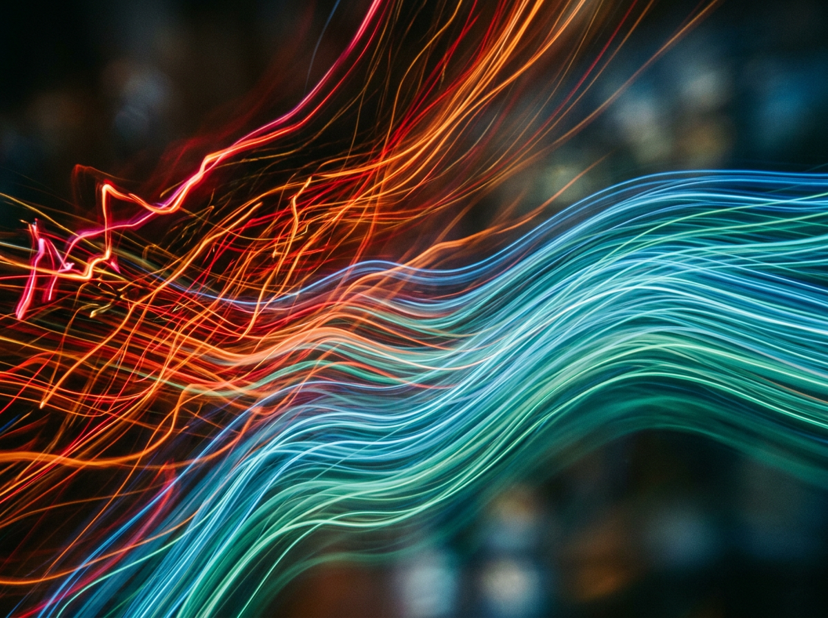 Colorful neon light trails in red, orange, blue, and green forming wavy patterns